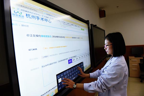A member of medical staff operates big-screen online diagnostic equipment at a medical center in Hangzhou, capital of Zhejiang province. LONG WEI / FOR CHINA DAILY A member of medical staff operates big-screen online diagnostic equipment at a medical center in Hangzhou, capital of Zhejiang province. LONG WEI / FOR CHINA DAILY