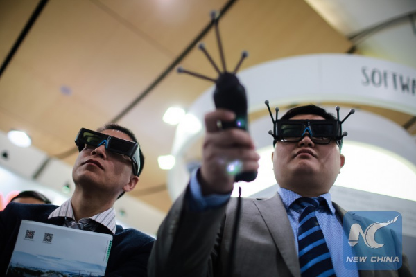 Fair-goers try virtual reality glasses at Huawei's stand of the Hanover Fair in 2016 in Hanover, Germany, on April 26, 2016. Some 700 exhibitors from China, the second only to the host country in terms of the number of exhibitors, attended the fair. (Xinhua/Zhang Fan) Fair-goers try virtual reality glasses at Huawei's stand of the Hanover Fair in 2016 in Hanover, Germany, on April 26, 2016. Some 700 exhibitors from China, the second only to the host country in terms of the number of exhibitors, attended the fair. (Xinhua/Zhang Fan)