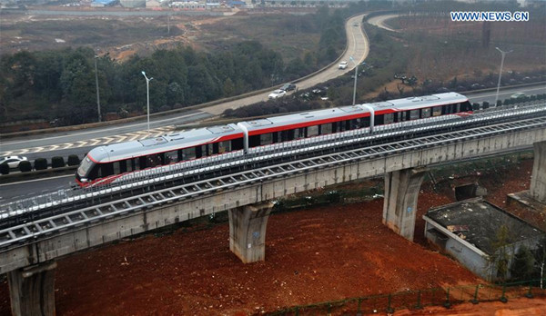 A system debugging is operated on a medium-low speed maglev train in Changsha, capital of central China's Hunan Province, Feb. 2, 2016. China's first domestically designed and manufactured magnetic levitation line, linking Changsha's south railway station and the airport, will be on a trial run with passengers in the first half of the year. It takes about ten minutes to complete the 18.55-km journey. (Xinhua/Long Hongtao) A system debugging is operated on a medium-low speed maglev train in Changsha, capital of central China's Hunan Province, Feb. 2, 2016. China's first domestically designed and manufactured magnetic levitation line, linking Changsha's south railway station and the airport, will be on a trial run with passengers in the first half of the year. It takes about ten minutes to complete the 18.55-km journey. (Xinhua/Long Hongtao)