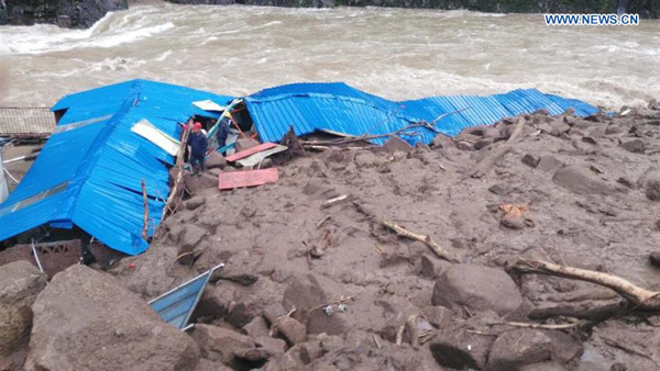 Photo taken by a mobile phone shows the landslide site in Taining County of Sanming City, southeast China's Fujian Province, May 8, 2016. Thirty-five people got lost after a landslide hit a construction site in Taining Sunday morning. (Xinhua/Qiu Canwang) Photo taken by a mobile phone shows the landslide site in Taining County of Sanming City, southeast China's Fujian Province, May 8, 2016. Thirty-five people got lost after a landslide hit a construction site in Taining Sunday morning. (Xinhua/Qiu Canwang)