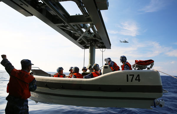 Troops of the South China Sea Fleet of the People's Liberation Army Navy conduct a drill on waters off the Xisha Islands on Thursday. Li Youtao / China News Service Troops of the South China Sea Fleet of the People's Liberation Army Navy conduct a drill on waters off the Xisha Islands on Thursday. Li Youtao / China News Service