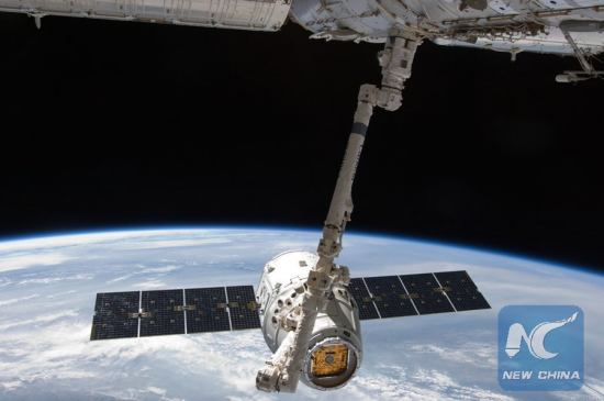 The SpaceX Dragon capsule is connected with the International Space Station with the robotic arm, on May 25. 2012. U.S. companySpaceX's unmanned Dragon capsule, the first commercial spacecraft to visit the International Space Station, was released from the orbital outpost.(Xinhua/file photo NASA) The SpaceX Dragon capsule is connected with the International Space Station with the robotic arm, on May 25. 2012. U.S. companySpaceX's unmanned Dragon capsule, the first commercial spacecraft to visit the International Space Station, was released from the orbital outpost.(Xinhua/file photo NASA)