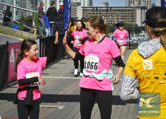 A mother celebrates with her daughter at the finish line during the Mother's Day CharityRun held in Vancouver, Canada, May 8, 2016. (Photo: Xinhua/Liang Sen) A mother celebrates with her daughter at the finish line during the Mother's Day CharityRun held in Vancouver, Canada, May 8, 2016. (Photo: Xinhua/Liang Sen)
