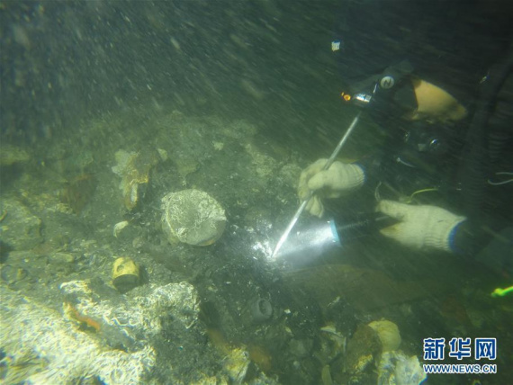 An archaeologist works at the shipwreck of the Zhiyuan, which was sunk by the Japanese navy during the first Sino-Japanese War in 1894, in Liaoning Province. (Photo/Xinhua) An archaeologist works at the shipwreck of the Zhiyuan, which was sunk by the Japanese navy during the first Sino-Japanese War in 1894, in Liaoning Province. (Photo/Xinhua)