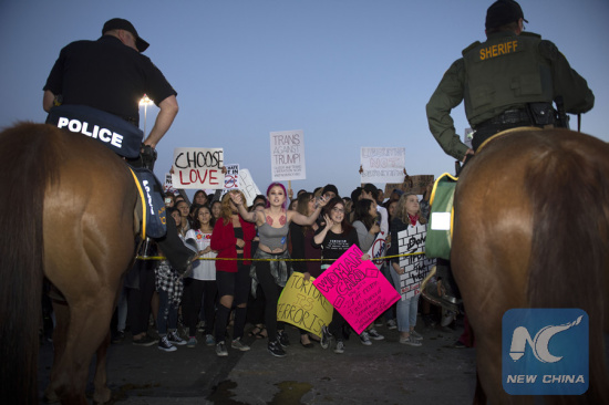 File photo: Protesters react outside a Donald Trump campaign rally in Orange County, southern California, April 28, 2016. (Photo: Xinhua/Yang Lei) File photo: Protesters react outside a Donald Trump campaign rally in Orange County, southern California, April 28, 2016. (Photo: Xinhua/Yang Lei)