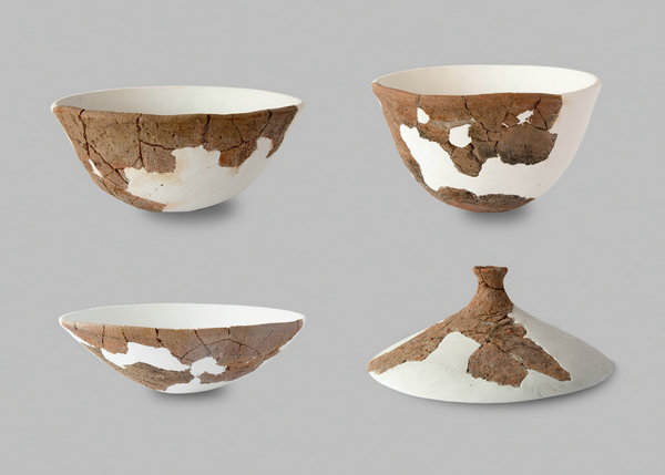 Artifacts unearthed from the Neolithic Age site of Hainan province. (Photo provided to China Daily) Artifacts unearthed from the Neolithic Age site of Hainan province. (Photo provided to China Daily)