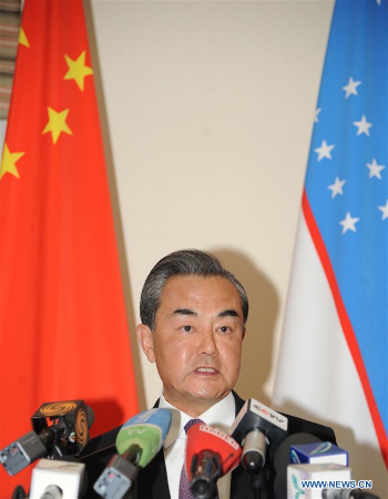 Chinese Foreign Minister Wang Yi addresses reporters after attending a meeting of the Shanghai Cooperation Organization (SCO) foreign ministers in the capital of Uzbekistan on May 24, 2016. (Photo: Xinhua/Sadat) Chinese Foreign Minister Wang Yi addresses reporters after attending a meeting of the Shanghai Cooperation Organization (SCO) foreign ministers in the capital of Uzbekistan on May 24, 2016. (Photo: Xinhua/Sadat)