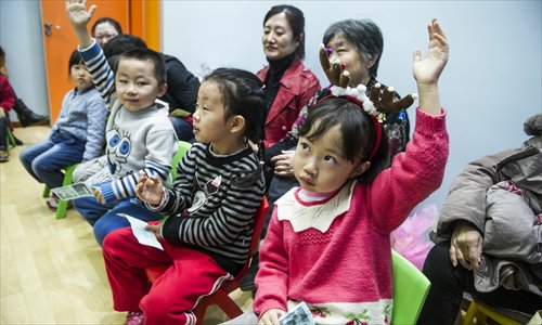A young girl gets into the Christmas spirit by wearing reindeer antlers during a class on December 24 at an English training center in Maliandao, Xicheng district. Photo: Li Hao/GT A young girl gets into the Christmas spirit by wearing reindeer antlers during a class on December 24 at an English training center in Maliandao, Xicheng district. Photo: Li Hao/GT