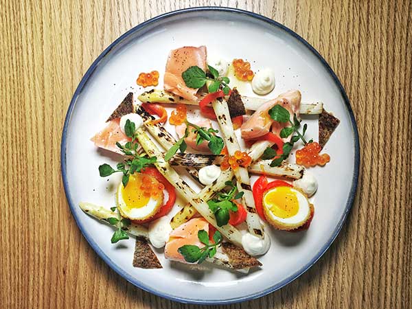 Grilled white asparagus with salmon (above) at Feast restaurant. (Photo provided to China Daily) Grilled white asparagus with salmon (above) at Feast restaurant. (Photo provided to China Daily)