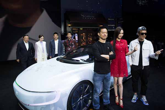 Co-founder and head of Le Holdings Co Jia Yueting (front left), actress Tang Yan (front center), actor Sun Honglei (front right), poses in front of all-electric battery concept car LeSEE with guests during a ceremony in Beijing, China April 20, 2016. (Photo provided to chinadaily.com.cn) Co-founder and head of Le Holdings Co Jia Yueting (front left), actress Tang Yan (front center), actor Sun Honglei (front right), poses in front of all-electric battery concept car LeSEE with guests during a ceremony in Beijing, China April 20, 2016. (Photo provided to chinadaily.com.cn)