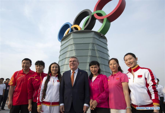 International Olympic Committee President Thomas Bach (4th Left) poses with representatives of Olympic champions of China during the opening ceremony of the Beijing Olympic Tower in Beijing, capital of China, on June 12, 2016. (Photo: Xinhua/Ju Huansong) International Olympic Committee President Thomas Bach (4th Left) poses with representatives of Olympic champions of China during the opening ceremony of the Beijing Olympic Tower in Beijing, capital of China, on June 12, 2016. (Photo: Xinhua/Ju Huansong)