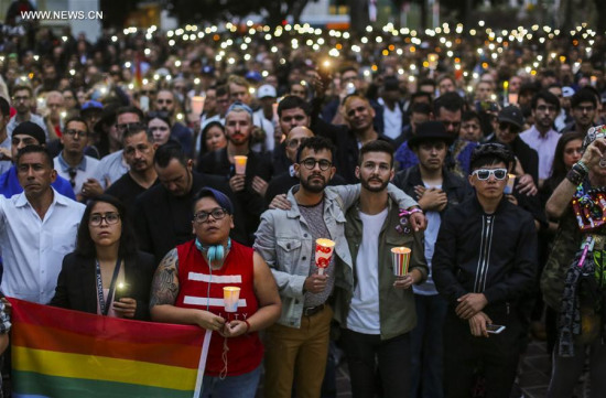 People attend a candlelight vigil at Los Angeles City Hall for the victims of Sunday's Orlando nightclub shooting incident, in Los Angeles, California, the United States, June 13, 2016. (Xinhua/Zhao Hanrong) People attend a candlelight vigil at Los Angeles City Hall for the victims of Sunday's Orlando nightclub shooting incident, in Los Angeles, California, the United States, June 13, 2016. (Xinhua/Zhao Hanrong)
