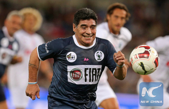 Former Argentinian soccer star Diego Maradona chases the ball in a charity match in Rome, Italy on Sept. 1, 2014. (Photo/Xinhua) Former Argentinian soccer star Diego Maradona chases the ball in a charity match in Rome, Italy on Sept. 1, 2014. (Photo/Xinhua)