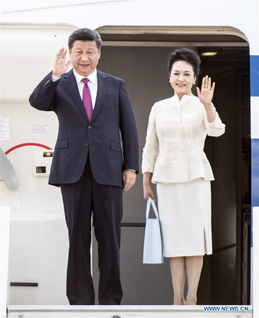 Chinese President Xi Jinping (L) and his wife Peng Liyuan wave as they arrive at the airport in Warsaw, Poland, June 19, 2016. Xi Jinping arrived in Warsaw Sunday for a state visit to Poland. (Photo: Xinhua/Xie Huanchi) Chinese President Xi Jinping (L) and his wife Peng Liyuan wave as they arrive at the airport in Warsaw, Poland, June 19, 2016. Xi Jinping arrived in Warsaw Sunday for a state visit to Poland. (Photo: Xinhua/Xie Huanchi)