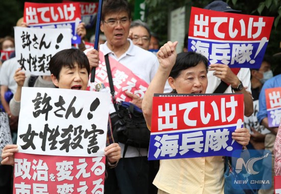 Demonstrators hold placards during a rally against the US military presence in Tokyo, Japan, on June 19, 2016, following the alleged rape, murder and dumping of a 20-year-old local woman by Kenneth Franklin Shinzato, 32, a former U.S. Marine. (Xinhua/Liu Tian) Demonstrators hold placards during a rally against the US military presence in Tokyo, Japan, on June 19, 2016, following the alleged rape, murder and dumping of a 20-year-old local woman by Kenneth Franklin Shinzato, 32, a former U.S. Marine. (Xinhua/Liu Tian)