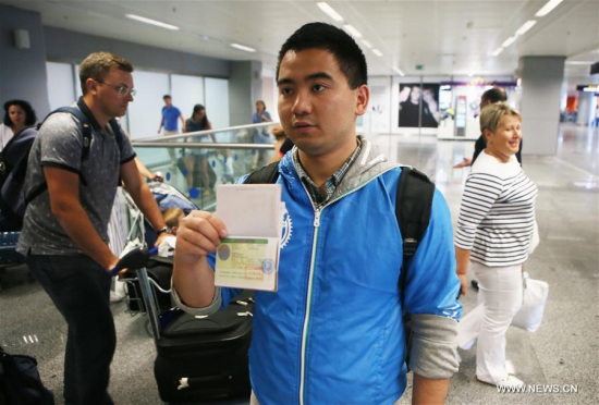 A Chinese traveller displays his visa-on-arrival at the Boryspil airport in Kiev, Ukraine, on June 20, 2016. (Xinhua) A Chinese traveller displays his visa-on-arrival at the Boryspil airport in Kiev, Ukraine, on June 20, 2016. (Xinhua)