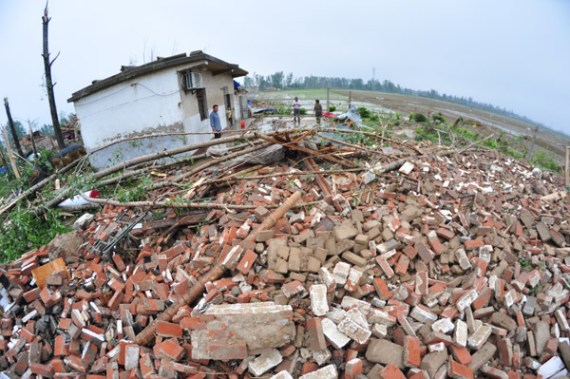 Villagers survey the rubble of a collapsed house after a tornado struck Funing in Jiangsu province on Thursday. (Provided to China Daily) Villagers survey the rubble of a collapsed house after a tornado struck Funing in Jiangsu province on Thursday. (Provided to China Daily)