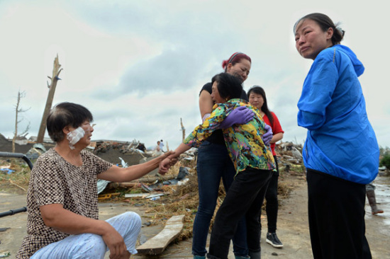 Family members of victims comfort each other on Friday, the day after a tornado hit Funing county in Yancheng, Jiangsu province. (Photo: China Daily/Lai Xinlin) Family members of victims comfort each other on Friday, the day after a tornado hit Funing county in Yancheng, Jiangsu province. (Photo: China Daily/Lai Xinlin)