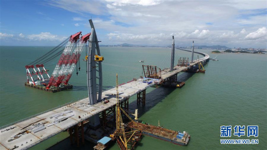 The main road structure on the final segment of the Hong Kong-Zhuhai-Macao Bridge is completed on June 29, 2016. (Photo/Xinhua) The main road structure on the final segment of the Hong Kong-Zhuhai-Macao Bridge is completed on June 29, 2016. (Photo/Xinhua)