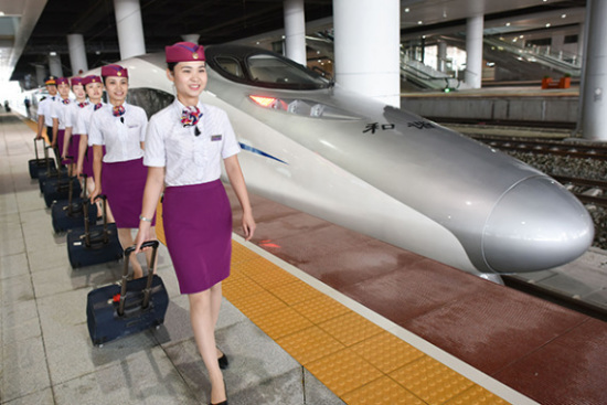 A group of attendants ready for boarding a high speed train bound for Kunming from Shanghai. (Photo/Xinhua) A group of attendants ready for boarding a high speed train bound for Kunming from Shanghai. (Photo/Xinhua)