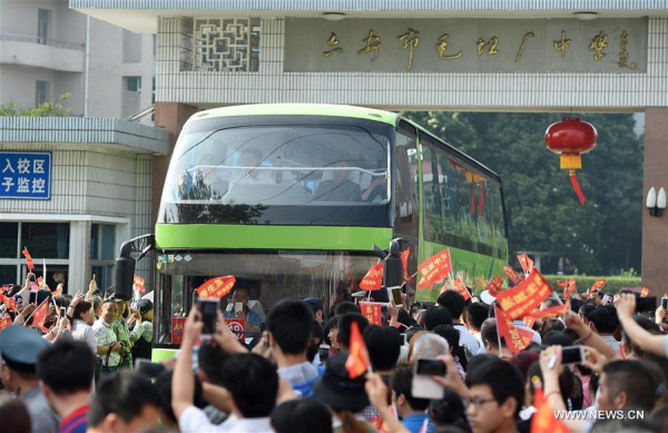 Parents and local residents see off G12 students of Maotanchang High School (including Jin'an High School) in Maotanchang Town of Lu'an City, east China's Anhui Province, June 5, 2016. A total of 19 shuttle buses carrying nearly 1,000 students set off here to examination venues in Lu'an City, for the upcoming national college entrance exam, or "gaokao", on Sunday. (Photo: Xinhua/Guo Chen) Parents and local residents see off G12 students of Maotanchang High School (including Jin'an High School) in Maotanchang Town of Lu'an City, east China's Anhui Province, June 5, 2016. A total of 19 shuttle buses carrying nearly 1,000 students set off here to examination venues in Lu'an City, for the upcoming national college entrance exam, or "gaokao", on Sunday. (Photo: Xinhua/Guo Chen)