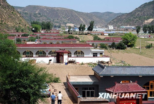The photo taken on June 9, 2009 shows residential buildings in Wuqi county. (Photo/ Xinhua) The photo taken on June 9, 2009 shows residential buildings in Wuqi county. (Photo/ Xinhua)