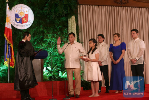 Rodrigo Duterte (2nd L) takes his oath during his inauguration as the 16th President of the Philippines at the Malacanang Palace in Manila, the Philippines, June 30, 2016. (Xinhua/Presidential Palace of the Philippines) Rodrigo Duterte (2nd L) takes his oath during his inauguration as the 16th President of the Philippines at the Malacanang Palace in Manila, the Philippines, June 30, 2016. (Xinhua/Presidential Palace of the Philippines)