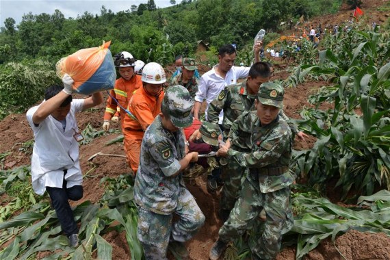 Rescuers transfer an injured person at the disaster site after a rain-triggered landslide hit Pianpo Village, Dafang County in the city of Bijie, southwest China's Guizhou Province, July 1, 2016. The landslide on Friday morning has caused 11 people dead and 12 missing. (Photo: Xinhua) Rescuers transfer an injured person at the disaster site after a rain-triggered landslide hit Pianpo Village, Dafang County in the city of Bijie, southwest China's Guizhou Province, July 1, 2016. The landslide on Friday morning has caused 11 people dead and 12 missing. (Photo: Xinhua)