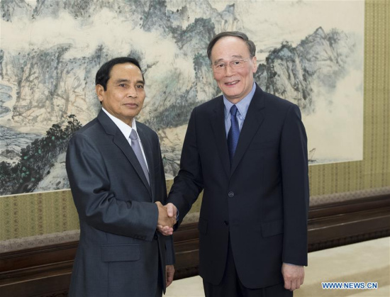 Wang Qishan (R), secretary of the Communist Party of China Central Commission for Discipline Inspection, meets with a delegation headed by Bounthong Chitmany (L), president of the ruling Lao People's Revolutionary Party Central Committee's Commission for Inspection, in Beijing, capital of China, July 7, 2016. (Xinhua/Wang Ye) Wang Qishan (R), secretary of the Communist Party of China Central Commission for Discipline Inspection, meets with a delegation headed by Bounthong Chitmany (L), president of the ruling Lao People's Revolutionary Party Central Committee's Commission for Inspection, in Beijing, capital of China, July 7, 2016. (Xinhua/Wang Ye)