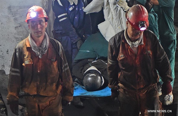 A survivor is carried out by rescuers in a mine after a fire accident in Benxi, northeast China's Liaoning Province, July 8, 2016. (Xinhua/Yang Qing) A survivor is carried out by rescuers in a mine after a fire accident in Benxi, northeast China's Liaoning Province, July 8, 2016. (Xinhua/Yang Qing)