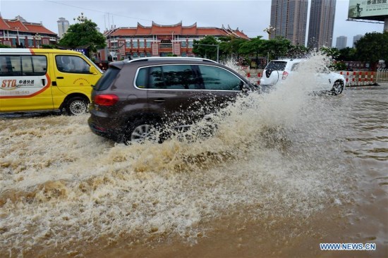Vehicles run on a flooded road in Putian City, southeast China's Fujian Province, July 9, 2016. Vehicles run on a flooded road in Putian City, southeast China's Fujian Province, July 9, 2016.