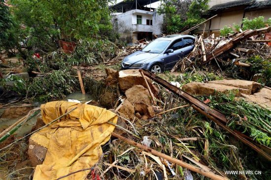 A car is buried in messes at Bandong Township after flooding in Minqing County, southeast China's Fujian Province, July 11, 2016. Xinhua/Zhang Guojun) A car is buried in messes at Bandong Township after flooding in Minqing County, southeast China's Fujian Province, July 11, 2016. Xinhua/Zhang Guojun)