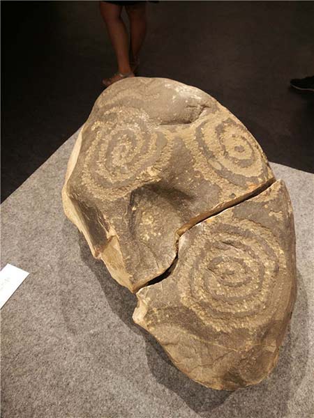 An ancient stone carving is among exhibits at the ongoing rock art show in Beijing. Photos by Wang Kaihao / China Daily An ancient stone carving is among exhibits at the ongoing rock art show in Beijing. Photos by Wang Kaihao / China Daily
