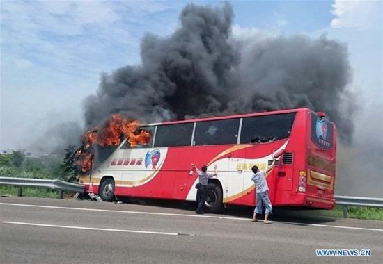 Photo taken on July 19, 2016 shows the accident site of a coach fire in Taipei, southeast China's Taiwan. A tourist coach caught fire on a highway near Taoyuan Airport on Tuesday, killing 26 people on board, including 24 mainland tourists from northeastern Liaoning Province. (Xinhua) Photo taken on July 19, 2016 shows the accident site of a coach fire in Taipei, southeast China's Taiwan. A tourist coach caught fire on a highway near Taoyuan Airport on Tuesday, killing 26 people on board, including 24 mainland tourists from northeastern Liaoning Province. (Xinhua)