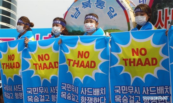 People from Seongju county hold banners to protest against the deployment of the Terminal High Altitude Area Defense (THAAD), during a rally in Seoul, capital of South Korea, on July 21, 2016. (Xinhua/Yao Qilin) People from Seongju county hold banners to protest against the deployment of the Terminal High Altitude Area Defense (THAAD), during a rally in Seoul, capital of South Korea, on July 21, 2016. (Xinhua/Yao Qilin)