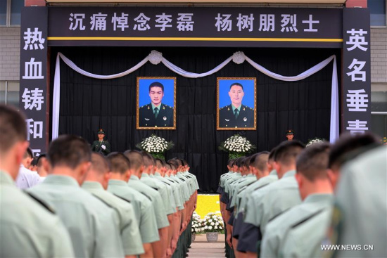 A funeral ceremony is held to bid farewell to deceased Chinese UN peacekeepers Yang Shupeng and Li Lei in Xuchang, central China's Henan Province, July 21, 2016. (Xinhua/Zeng Tao) A funeral ceremony is held to bid farewell to deceased Chinese UN peacekeepers Yang Shupeng and Li Lei in Xuchang, central China's Henan Province, July 21, 2016. (Xinhua/Zeng Tao)