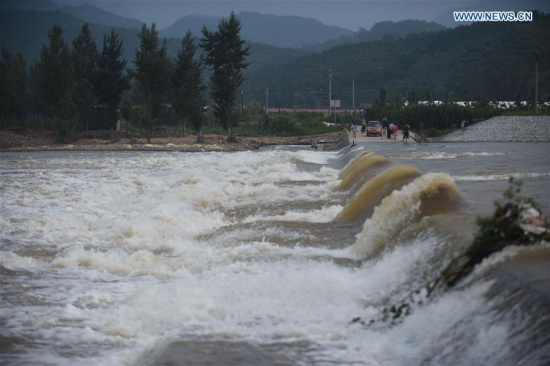 A swollen river is seen at Dayangshugou Village, Huludao City, northeast China's Liaoning Province, July 21, 2016. (Xinhua/Pan Yulong) A swollen river is seen at Dayangshugou Village, Huludao City, northeast China's Liaoning Province, July 21, 2016. (Xinhua/Pan Yulong)