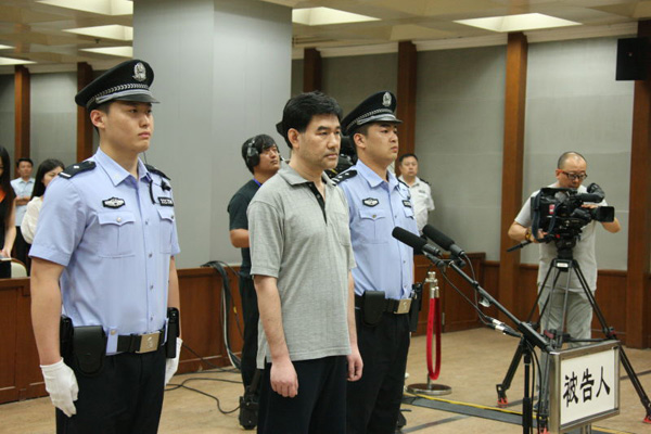 Sun Xin, previously one of China's most-wanted economic fugitives, stands trial at Beijing No 2 Intermediate People's Court on July 26, 2016. (Photo/provided to chinadaily.com.cn) Sun Xin, previously one of China's most-wanted economic fugitives, stands trial at Beijing No 2 Intermediate People's Court on July 26, 2016. (Photo/provided to chinadaily.com.cn)