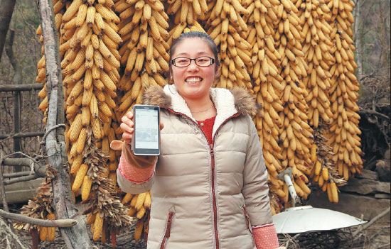 Chengxian villager Su Yanyan shows her online store on her smartphone. Many local famers have improved their standards of living through e-commerce. Xiao Zhengqiang/Xinhua Chengxian villager Su Yanyan shows her online store on her smartphone. Many local famers have improved their standards of living through e-commerce. Xiao Zhengqiang/Xinhua