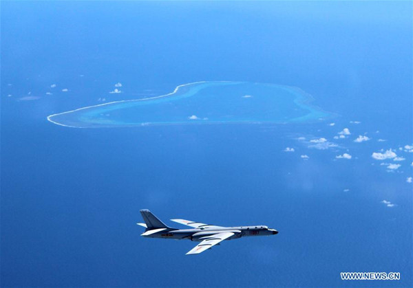 Undated photo shows a Chinese H-6K bomber patrolling islands and reefs including Huangyan Dao in the South China Sea. The People's Liberation Army (PLA) Air Force conducted a combat air patrol in the South China Sea recently, which will become a regular practice in the future, said a military spokesperson on July 18, 2016. (Photo/Xinhua) Undated photo shows a Chinese H-6K bomber patrolling islands and reefs including Huangyan Dao in the South China Sea. The People's Liberation Army (PLA) Air Force conducted a combat air patrol in the South China Sea recently, which will become a regular practice in the future, said a military spokesperson on July 18, 2016. (Photo/Xinhua)