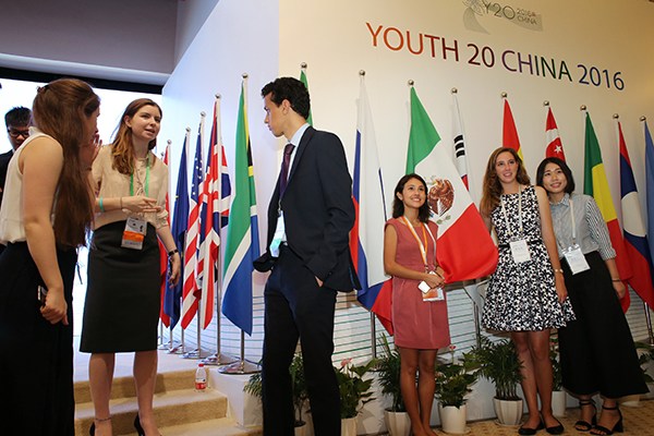 Representatives talk on the sidelines of Y20 China 2016 in Shanghai on Wednesday. The event for young adults is affiliated with the G20 Leaders Summit, which will take place in September. (Photo/China Daily) Representatives talk on the sidelines of Y20 China 2016 in Shanghai on Wednesday. The event for young adults is affiliated with the G20 Leaders Summit, which will take place in September. (Photo/China Daily)