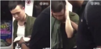 Photo shows that a black man slaps a Chinese man around the head twice while riding the subway.(Photo/Screenshot) Photo shows that a black man slaps a Chinese man around the head twice while riding the subway.(Photo/Screenshot)