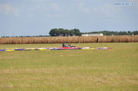 Debris of the balloon is seen at the site of a balloon crash accident near Lockhart, a city in the central part of the U.S. state of Texas, July 30, 2016. U.S. Texas Department of PUBLIC Safety has confirmed that 16 people were killed on Saturday morning after a hot air balloon caught on fire and crashed near Lockhart. The accident occurred shortly after 7:40 a.m. local time on Saturday near Lockhart, when the hot air balloon with at least 16 people on board crashed into a pasture, the Federal Aviation Administration (FAA) said in a statement on Saturday. (Xinhua/Zhang Yongxing) Debris of the balloon is seen at the site of a balloon crash accident near Lockhart, a city in the central part of the U.S. state of Texas, July 30, 2016. U.S. Texas Department of PUBLIC Safety has confirmed that 16 people were killed on Saturday morning after a hot air balloon caught on fire and crashed near Lockhart. The accident occurred shortly after 7:40 a.m. local time on Saturday near Lockhart, when the hot air balloon with at least 16 people on board crashed into a pasture, the Federal Aviation Administration (FAA) said in a statement on Saturday. (Xinhua/Zhang Yongxing)