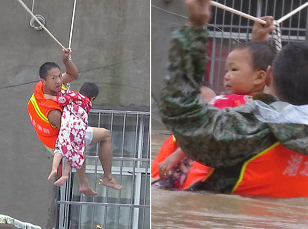 Liu Xiaopeng, a firefighter, uses ropes to rescue a stranded child with the help of comrade in Dawu county, Hubei province, on Friday. (Photo by Wang Jida/China Daily) Liu Xiaopeng, a firefighter, uses ropes to rescue a stranded child with the help of comrade in Dawu county, Hubei province, on Friday. (Photo by Wang Jida/China Daily)