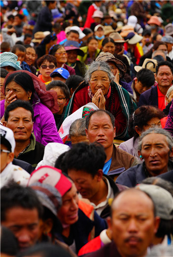 Followers of the 11th Panchen Lama are greeted at the opening of his Kalachakra instructions on Thursday in Xigaze, the second-largest city of the Tibet autonomous region. An estimated 50,000 devotees are expected to attend the fourday ritual. PHOTOS BY GALSANG JIGME / TIBET DAILY