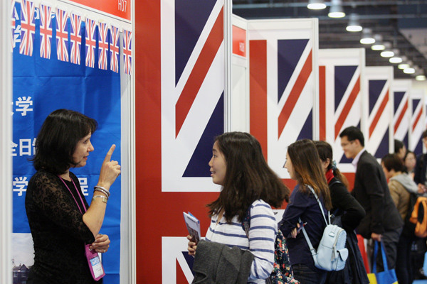 A British consultant talks with a visitor over the weekend at the 2015 China Education Expo in Beijing. (WANG ZHUANGFEI/ CHINA DAILY) A British consultant talks with a visitor over the weekend at the 2015 China Education Expo in Beijing. (WANG ZHUANGFEI/ CHINA DAILY)