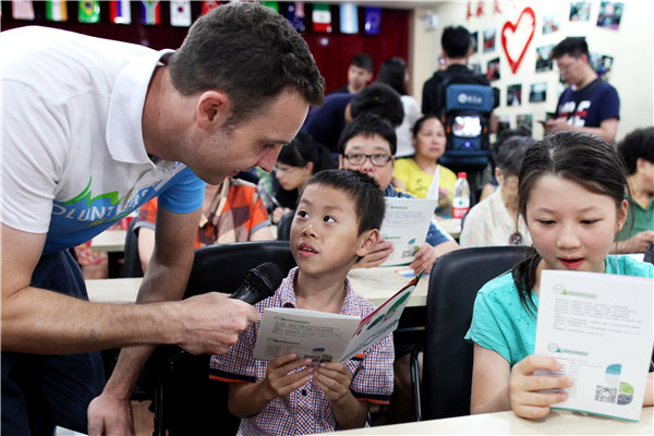Timothy Clancy, an Australian student at Zhejiang University, teaches children English as he works as a volunteer for the upcoming G20 Summit in Hangzhou. Security rehearsals for the summit have been carried out between 11pm and 4am. ZHU XINGXIN / CHINA DAILY Timothy Clancy, an Australian student at Zhejiang University, teaches children English as he works as a volunteer for the upcoming G20 Summit in Hangzhou. Security rehearsals for the summit have been carried out between 11pm and 4am. ZHU XINGXIN / CHINA DAILY