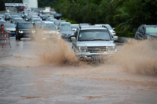 Cars go through a waterlogged road in Nanning, capital of south China's Guangxi Zhuang Autonomous Region, Aug. 3, 2016. Typhoon Nida resulted in torrential rain here on Wednesday. (Xinhua/Zhou Hua) Cars go through a waterlogged road in Nanning, capital of south China's Guangxi Zhuang Autonomous Region, Aug. 3, 2016. Typhoon Nida resulted in torrential rain here on Wednesday. (Xinhua/Zhou Hua)