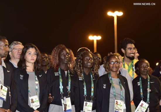 Members of the delegation of Refugee Olympics Team to the Rio 2016 Olympic Games attend the flag-raising ceremony at the Olympic Village in Rio de Janeiro, Brazil, on Aug. 3, 2016. (Xinhua/Yue Yuewei) Members of the delegation of Refugee Olympics Team to the Rio 2016 Olympic Games attend the flag-raising ceremony at the Olympic Village in Rio de Janeiro, Brazil, on Aug. 3, 2016. (Xinhua/Yue Yuewei)