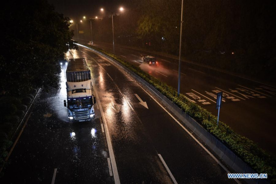 A truck runs amid heavy rain on a road in Shenzhen, south China's Guangdong Province, Aug. 2, 2016. (Xinhua/Mao Siqian) A truck runs amid heavy rain on a road in Shenzhen, south China's Guangdong Province, Aug. 2, 2016. (Xinhua/Mao Siqian)
